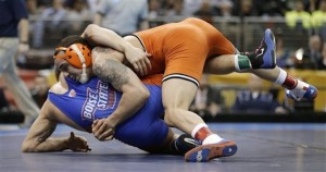 Oklahoma State's Jordan Oliver takes Boise StateÌs Jason Chamberlain to the mat during the 149-pound title match at the NCAA Division I wrestling championships, Saturday, March 23, 2013, in Des Moines, Iowa. Oliver won the match. (AP Photo/Charlie Neibergall)