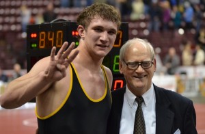 Solanco senior Thomas Haines celebrates his fourth PIAA State Championship with Clearfield's Jerry Maurey.