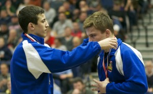 Franklin Regional's Michael Kemerer (Left) and Iowa's Max Thomson exchange medals at the 2015 Dapper Dan Classic.